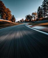 Curving track at sunset captures speed and motion dynamics photo