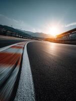 Evening light reflects on a winding race track in the mountains photo