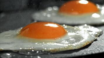 Eggs are fried in a pan. Filmed on a high-speed camera at 1000 fps. High quality FullHD footage video