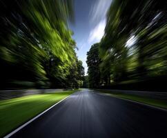 Racing through a twisting road surrounded by lush trees photo
