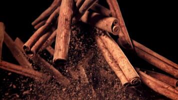 Cinnamon sticks fly up and down. Filmed on a high-speed camera at 1000 fps. High quality FullHD footage video