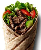 Savory beef wrap with fresh vegetables in a tortilla photo