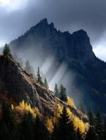 Mountains with trees and sunbeams shining through the clouds photo