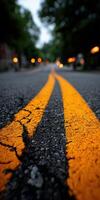A blurry image of a road with yellow lines photo