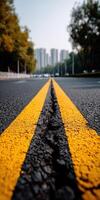 A road with yellow lines painted on it photo