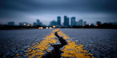 A crack in the asphalt of an empty road photo