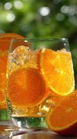 Refreshing citrus drink with ice and orange slices photo