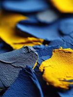 Scattered blue and yellow paint layers photo