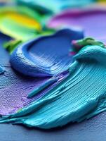 Vivid blue paint swirls on canvas create texture photo