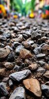 Gravel pathway along a busy city street under trees photo