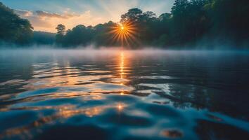 Lake Sunrise with Fog and Reflection in Water photo