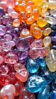 Colorful Translucent Gems in Various Shapes and Sizes on Surface photo