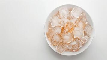 Clear Ice Cubes in a White Bowl on a Light Background photo