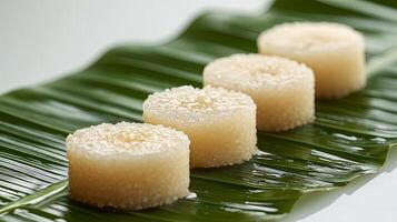 Fresh Sandesh Dessert on Banana Leaf with Clean White Background photo