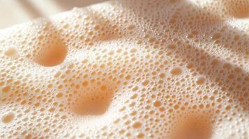 A close up of a soap bar with bubbles photo