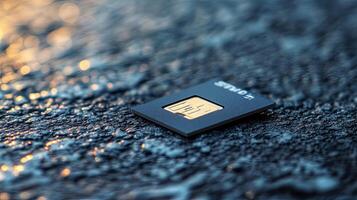 A small microchip sitting on top of a wet surface photo