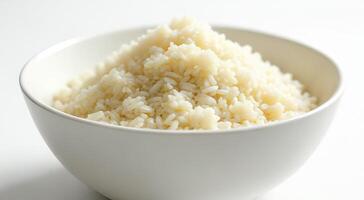 Steaming Bowl of White Rice Ready for Serving and Enjoyment photo