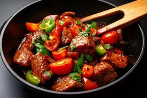 Chef preparing delicious beef stew with tomatoes, peppers and parsley in a pan photo