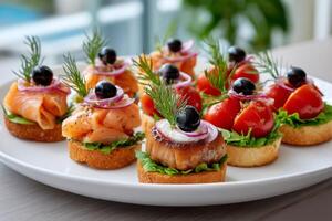 Catering service preparing canapes with salmon, tomatoes and black olives for a buffet photo