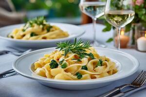Delicious pasta dish with rosemary and spinach is served on a restaurant table photo
