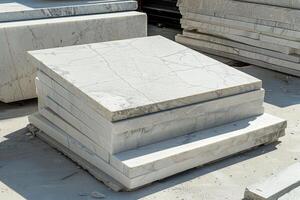 A display of neatly arranged white marble slabs in a shop, highlighting their smooth texture and elegance for architectural use photo