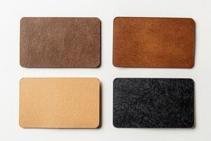 Set of four blank business cards on a white background showcasing different colors and textures, perfect for customization or branding ideas photo