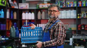 Senior Auto Parts Seller Displaying Socket Tool Set video