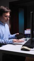 vertical Businessman finding empty wallet at office desk showing financial problems video