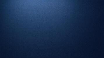 Dark blue textured wall surface with fine grain detail and soft lighting ideal for backgrounds or design backdrops. photo