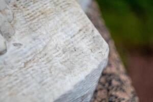Close-up of weathered stone surface with texture and natural patterns photo