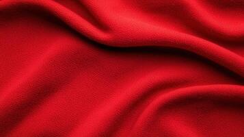 Vibrant red textured fabric with soft folds showing fine surface grain and cozy tactile appearance ideal for design backgrounds and textile projects. photo