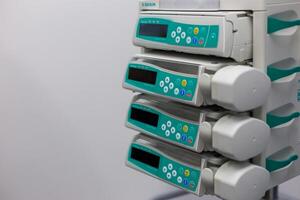 Moscow, Moscow region, Russia - 03.09.2023.Close-up view of medical infusion pumps with display screens and control buttons photo