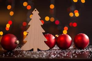 Spruce wooden toy on a dark table with white snow and red balls. photo