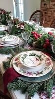 Elegant christmas table setting with festive evergreen decorations photo
