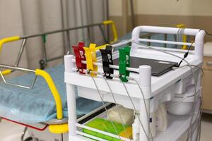 Multi-colored clips for electrodiagnosis, on a medical trolley photo