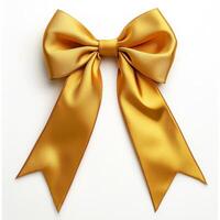 Elegant gold satin bow with long tails on white background photo