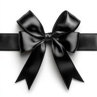 Elegant black satin ribbon bow with classic knot on white background photo