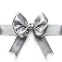 Elegant silver satin ribbon bow with tails on white background photo