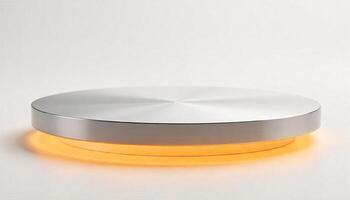 A round metal platform with a brushed silver surface and a warm orange light emanating from underneath, against a plain white background photo