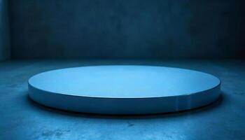 A round white platform with a metallic edge, on a blue surface, against a dark blue background photo