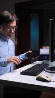 vertical Office worker checking empty wallet at night showing financial problems video
