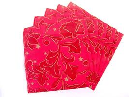 Red paper napkins with decoration ornament wallpaper photo