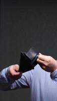 vertical close-up Office worker checking empty wallet experiencing financial problems video