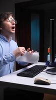 vertical Office worker blowing nose while working late at night video
