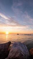 sunset in the sea with clouds turning red video