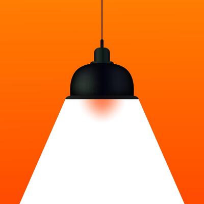 An orange and black light bulb hanging from a ceiling