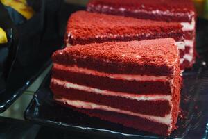 Red velvet cake slices displayed at a dessert shop during daytime photo