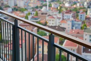 View from a balcony overlooking a city skyline during daylight photo