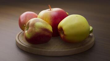 Looping animation around a composition of apples lying on a wooden board. Loop motion. Defocus. Close-up. video