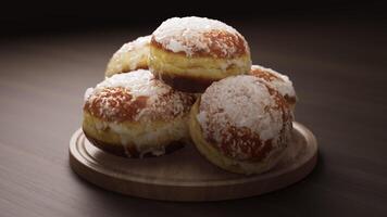 Looping animation around a composition of European classic donuts lying on a wooden board. Loop motion. Defocus. Close-up. video